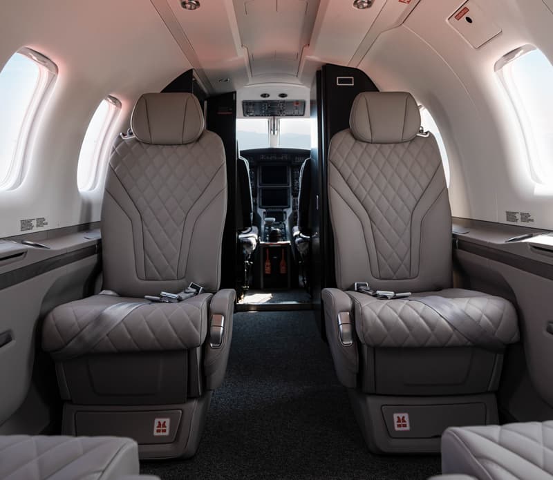 Bright leather seating inside a Pilatus PC-12 NGX cabin